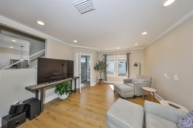 2802 Old Bayshore Way, Tampa, FL 33611 - living room with recessed lighting, baseboards, ornamental molding, and light wood finished floors
