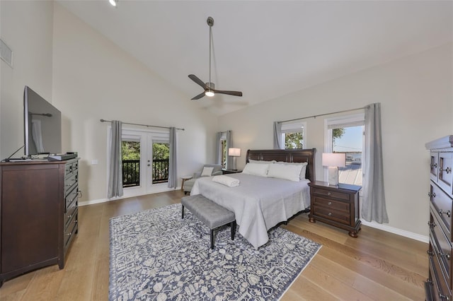 2802 Old Bayshore Way, Tampa, FL 33611 - bedroom with french doors, high vaulted ceiling, light wood finished floors, baseboards, and a ceiling fan