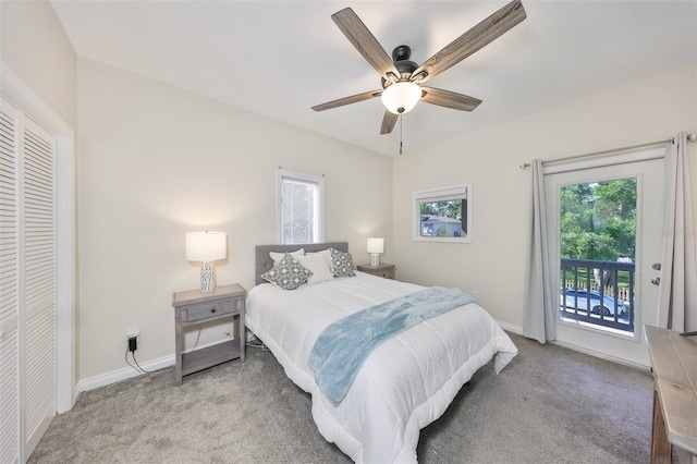 2802 Old Bayshore Way, Tampa, FL 33611 - carpeted bedroom featuring access to outside, multiple windows, baseboards, and ceiling fan