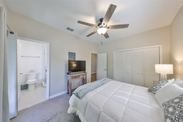 2802 Old Bayshore Way, Tampa, FL 33611 - bedroom with a closet, carpet, connected bathroom, baseboards, and ceiling fan