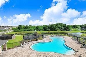 12168 Lily Magnolia Ln, Riverview, FL 33569 - pool with a patio and fence