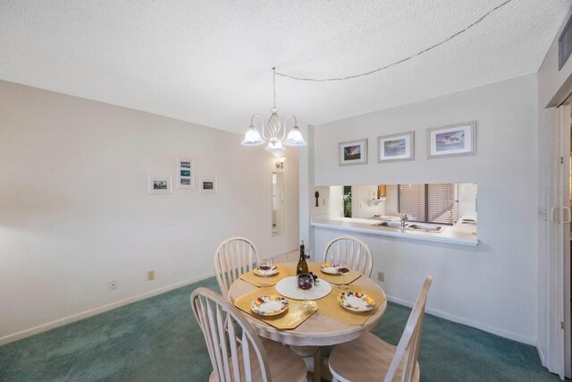 6357 Bahia Del Mar Blvd Unit 111, Saint Petersburg, FL 33715 - dining room featuring carpet floors, baseboards, and an inviting chandelier