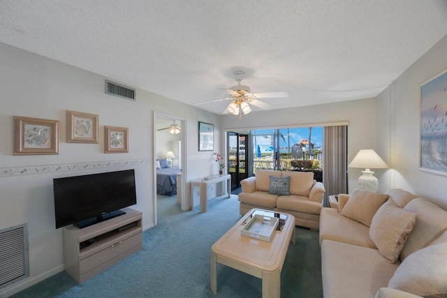6357 Bahia Del Mar Blvd Unit 111, Saint Petersburg, FL 33715 - living area featuring a ceiling fan, a textured ceiling, visible vents, and carpet
