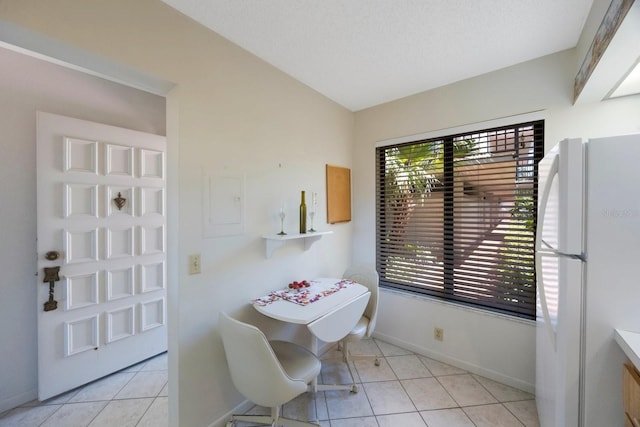 6357 Bahia Del Mar Blvd Unit 111, Saint Petersburg, FL 33715 - dining area featuring baseboards and light tile patterned flooring