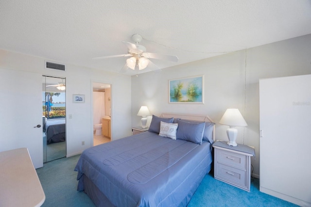 6357 Bahia Del Mar Blvd Unit 111, Saint Petersburg, FL 33715 - bedroom featuring visible vents, a ceiling fan, connected bathroom, and light colored carpet