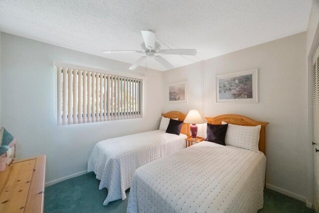 6357 Bahia Del Mar Blvd Unit 111, Saint Petersburg, FL 33715 - bedroom with carpet floors, baseboards, and a ceiling fan