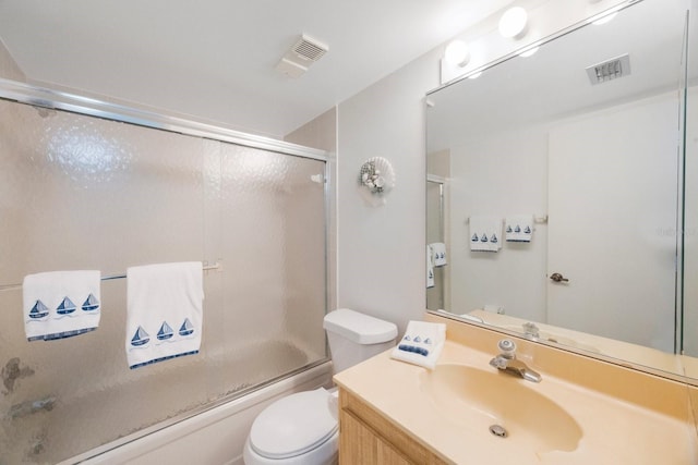 6357 Bahia Del Mar Blvd Unit 111, Saint Petersburg, FL 33715 - full bath with visible vents, bath / shower combo with glass door, toilet, and vanity