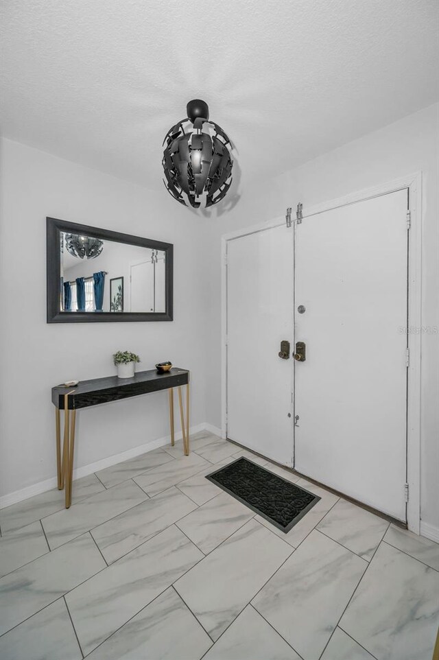 613 Valley Hill Dr, Brandon, FL 33510 - foyer entrance with baseboards