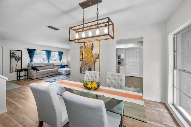 613 Valley Hill Dr, Brandon, FL 33510 - dining area featuring light wood-type flooring and baseboards