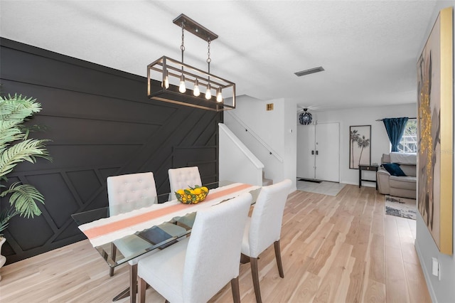 613 Valley Hill Dr, Brandon, FL 33510 - dining space featuring light wood-style flooring and stairway