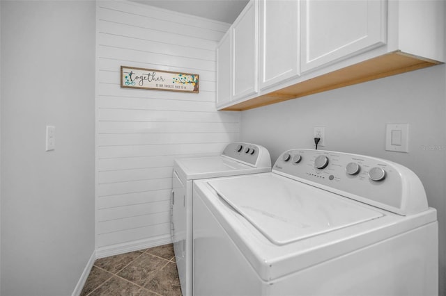 613 Valley Hill Dr, Brandon, FL 33510 - washroom with independent washer and dryer, cabinet space, baseboards, wooden walls, and dark tile patterned floors