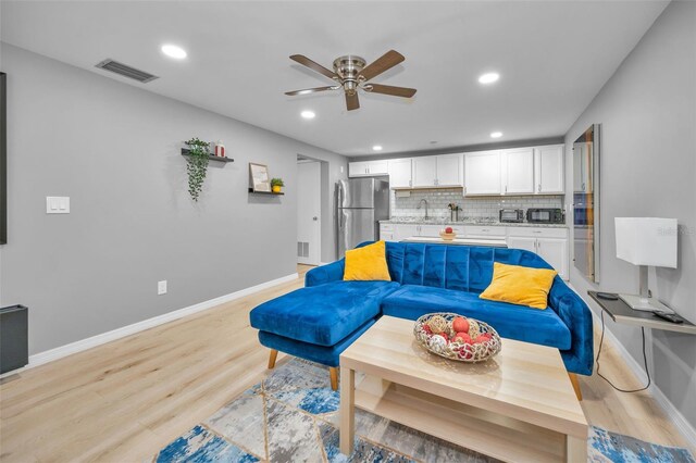613 Valley Hill Dr, Brandon, FL 33510 - living area with a ceiling fan, light wood finished floors, baseboards, and recessed lighting