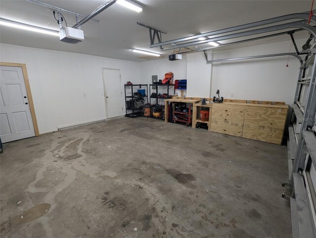 613 Valley Hill Dr, Brandon, FL 33510 - garage with a garage door opener and a workshop area
