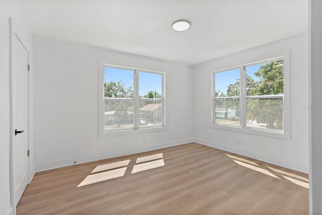 3000 19th Ave S, Saint Petersburg, FL 33712 - spare room featuring healthy amount of natural light, light wood-style floors, and baseboards