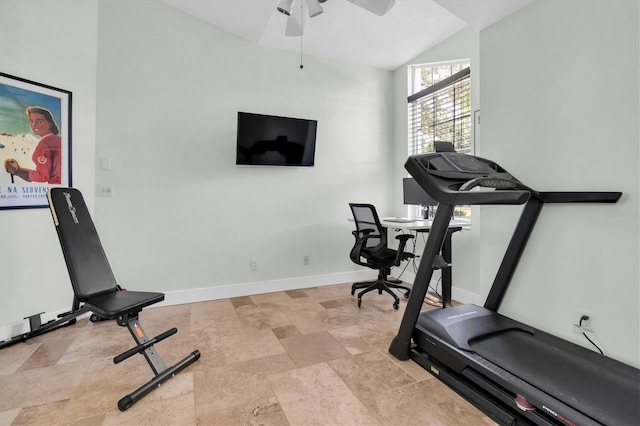 exercise room with stone finish flooring, lofted ceiling, a ceiling fan, and baseboards