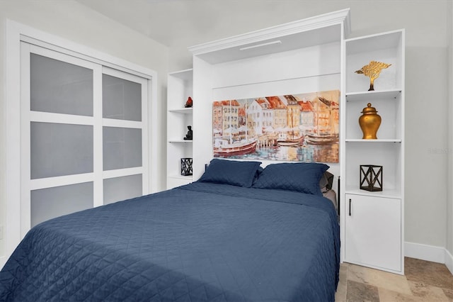 bedroom featuring baseboards
