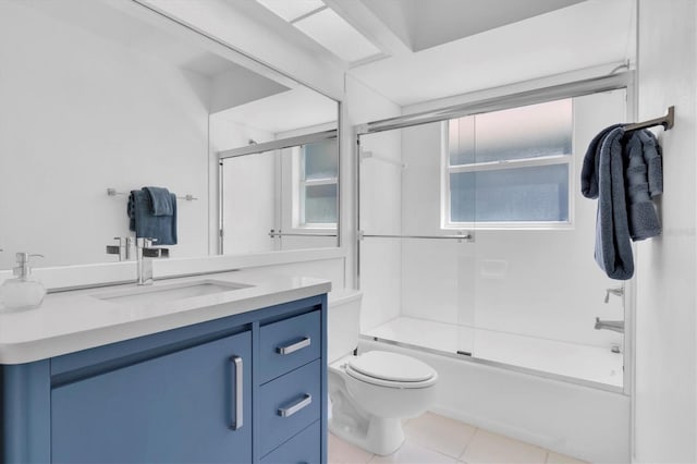 bathroom featuring bath / shower combo with glass door, toilet, vanity, and tile patterned floors