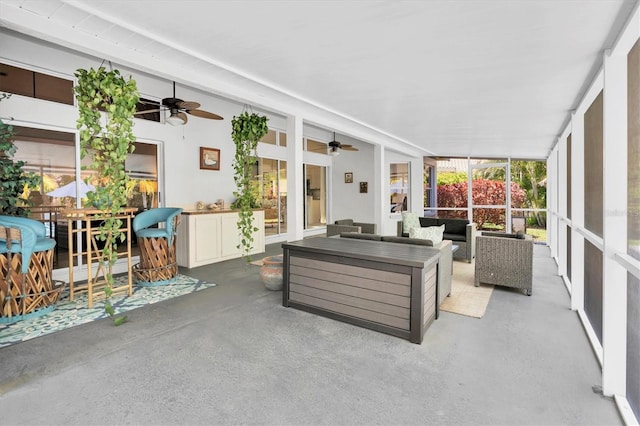 view of patio featuring a ceiling fan and an outdoor living space