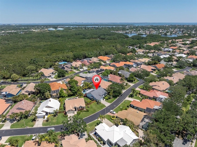 bird's eye view with a residential view and a water view