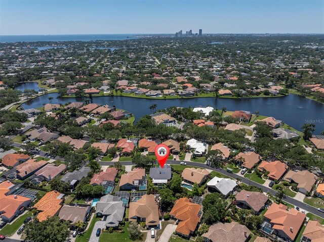 birds eye view of property featuring a residential view and a water view