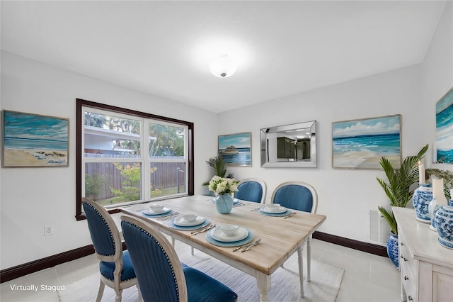 11797 David Ct, Largo, FL 33778 - dining space with baseboards and light tile patterned floors