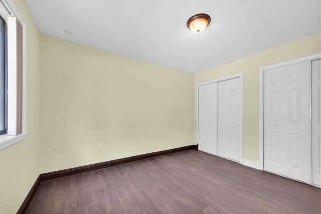 11797 David Ct, Largo, FL 33778 - unfurnished bedroom featuring wood finished floors and a closet