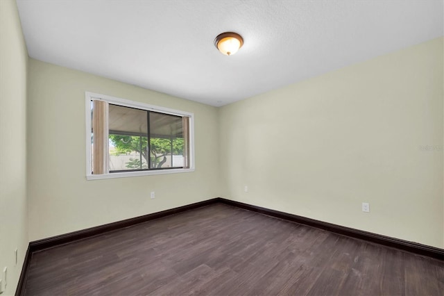 11797 David Ct, Largo, FL 33778 - unfurnished room featuring dark wood-style flooring and baseboards