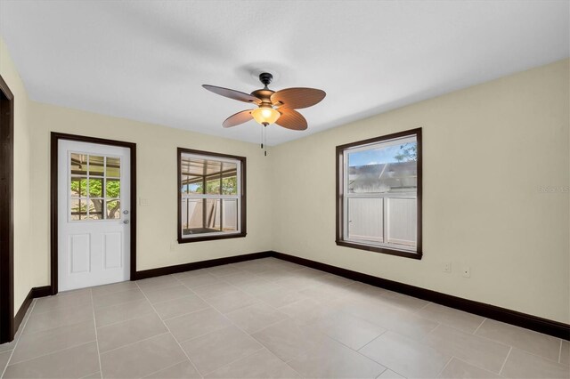 11797 David Ct, Largo, FL 33778 - spare room featuring baseboards and a ceiling fan