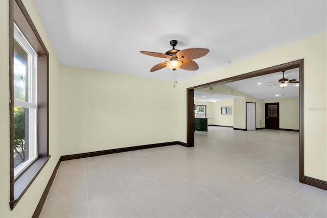 11797 David Ct, Largo, FL 33778 - empty room with ceiling fan, plenty of natural light, recessed lighting, and light tile patterned flooring