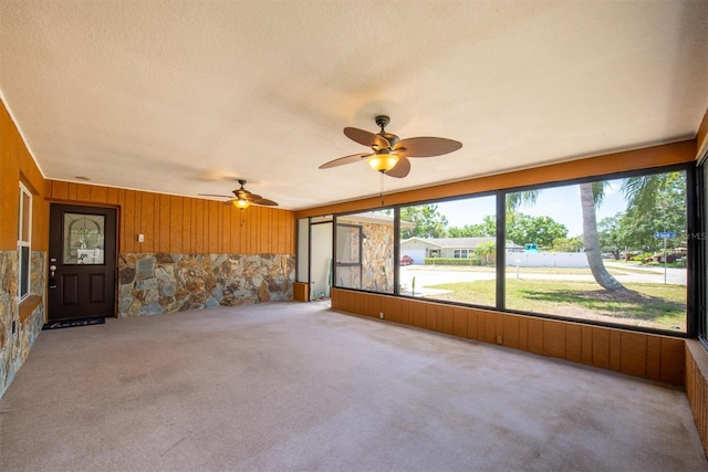 11797 David Ct, Largo, FL 33778 - unfurnished sunroom featuring a ceiling fan