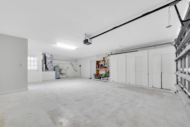 11797 David Ct, Largo, FL 33778 - garage featuring electric water heater and a garage door opener
