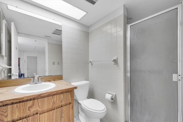 11797 David Ct, Largo, FL 33778 - bathroom with a shower stall, tile walls, and vanity