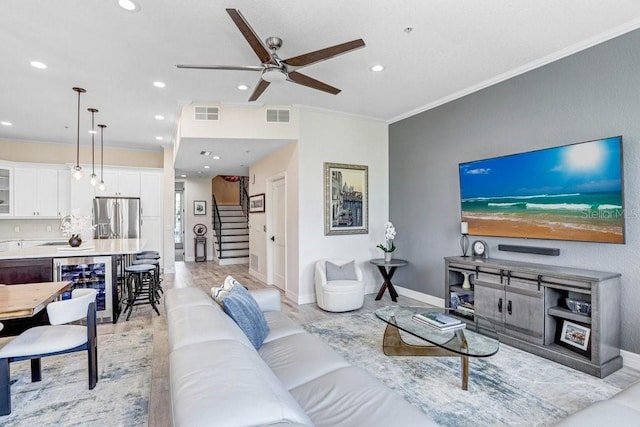 living area with beverage cooler, visible vents, a ceiling fan, and recessed lighting