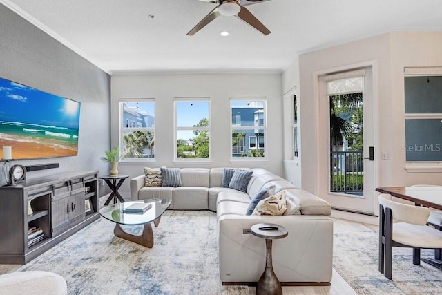 living area with recessed lighting, wood finished floors, a healthy amount of sunlight, and ceiling fan