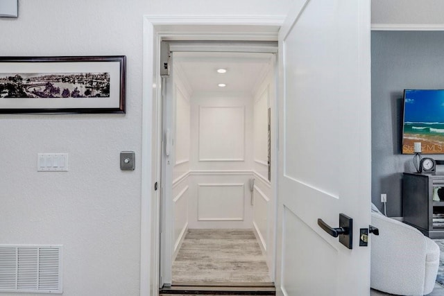 interior space with elevator and visible vents