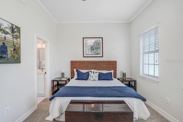 carpeted bedroom with ornamental molding, connected bathroom, and baseboards