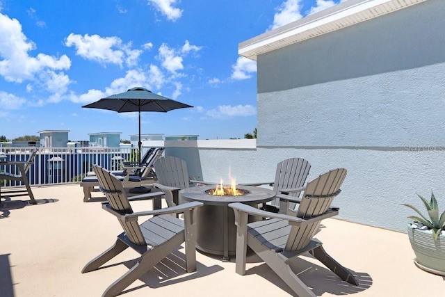 view of patio featuring an outdoor fire pit