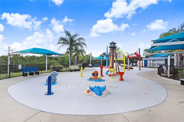 view of jungle gym featuring fence