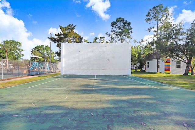 exterior space featuring playground community and fence