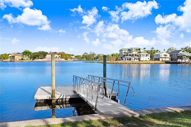view of dock featuring a residential view and a water view