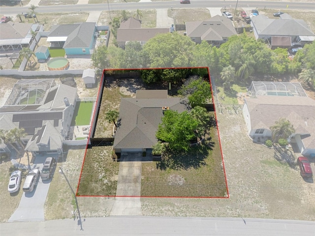 birds eye view of property with a residential view