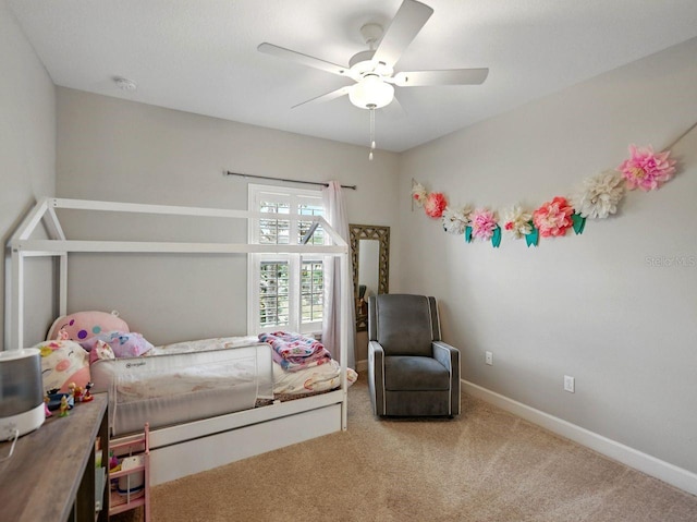 bedroom with baseboards, carpet, and ceiling fan