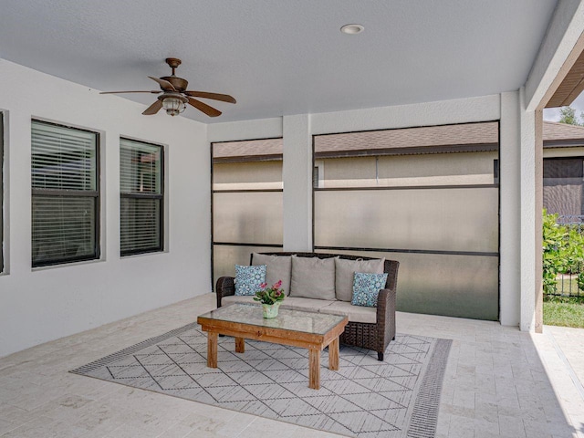 view of patio with ceiling fan and an outdoor hangout area