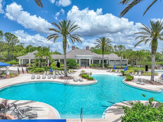 community pool featuring a patio area