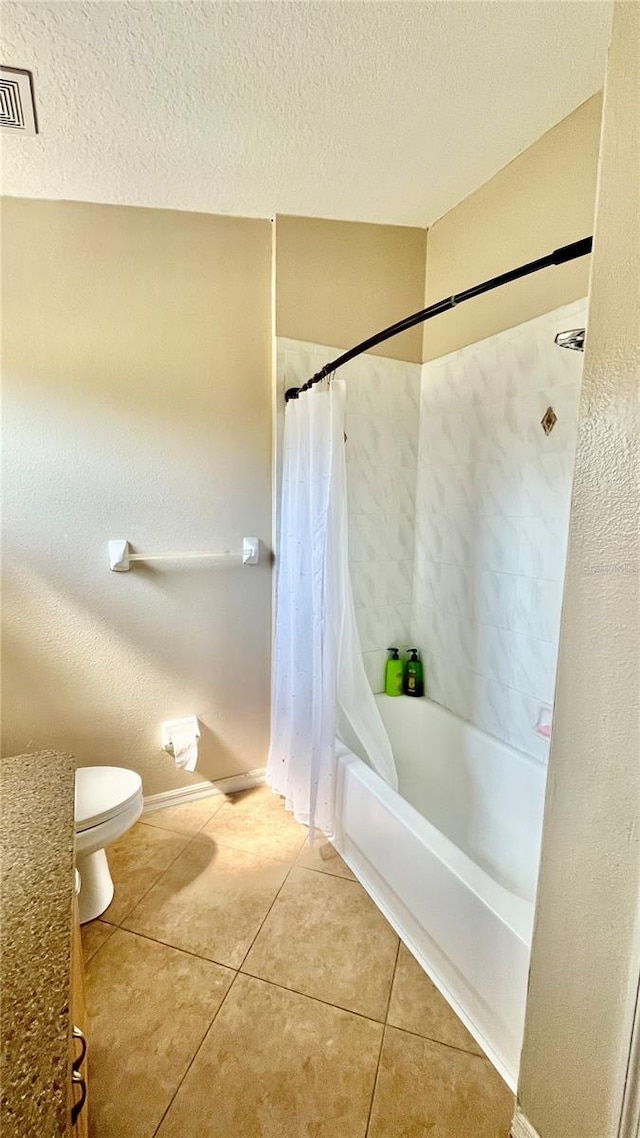 bathroom with toilet, shower / tub combo with curtain, a textured ceiling, visible vents, and tile patterned flooring