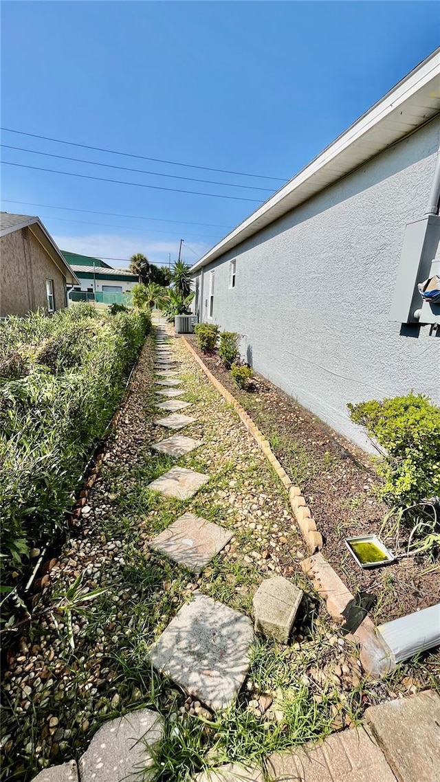 view of side of property with stucco siding