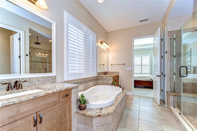 4289 Ortona Ln, Wesley Chapel, FL 33543 - bathroom with a shower stall, vanity, and a garden tub