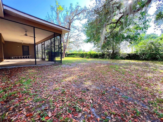 3907 Applegate Cir, Brandon, FL 33511 - view of yard with a sunroom, a patio, and ceiling fan
