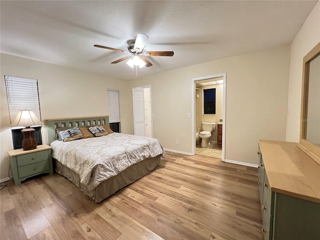 3907 Applegate Cir, Brandon, FL 33511 - bedroom featuring light wood finished floors, ensuite bathroom, and ceiling fan