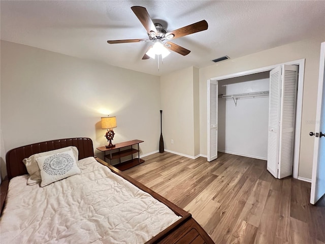 3907 Applegate Cir, Brandon, FL 33511 - bedroom featuring wood finished floors, a closet, and a ceiling fan